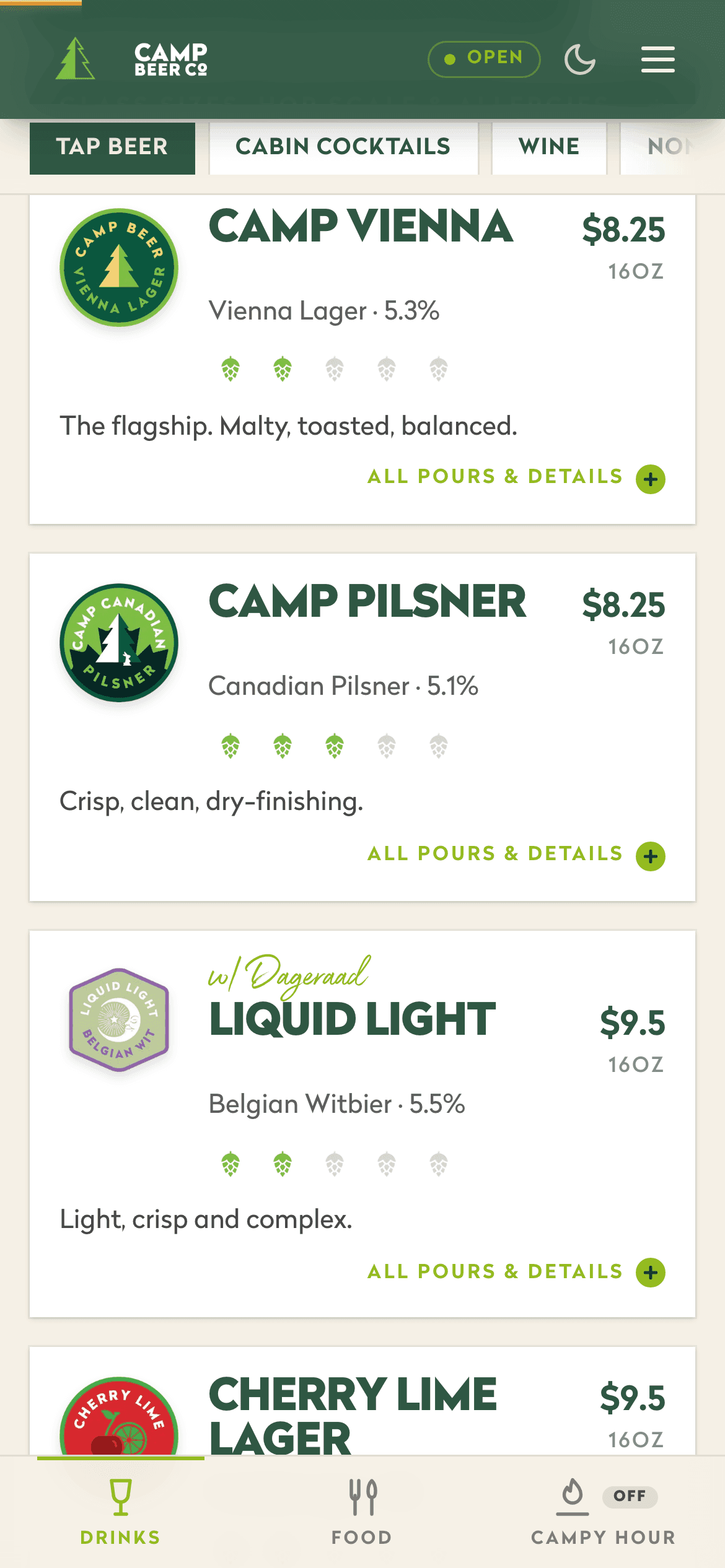 The taproom menu in light mode: cream background, forest green cards